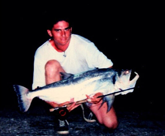 Armando kneeling with his first 20-lb Payara caught on the fly, Orinoco River1999