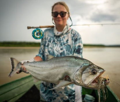 Angler holding a Payara caught on the Payara Dragon Fly Salton from boat