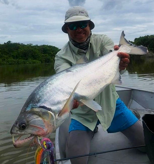 Angler holding a large payara caught on the Payara Dragon Fly Sardinata