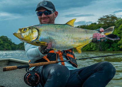 Smiling angler with a sardinata caught on the Red Head fly
